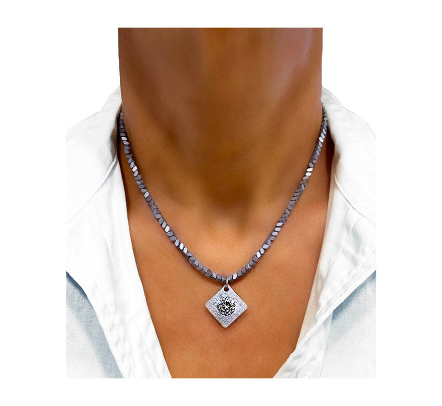 the aluminum solitaire hematite necklace