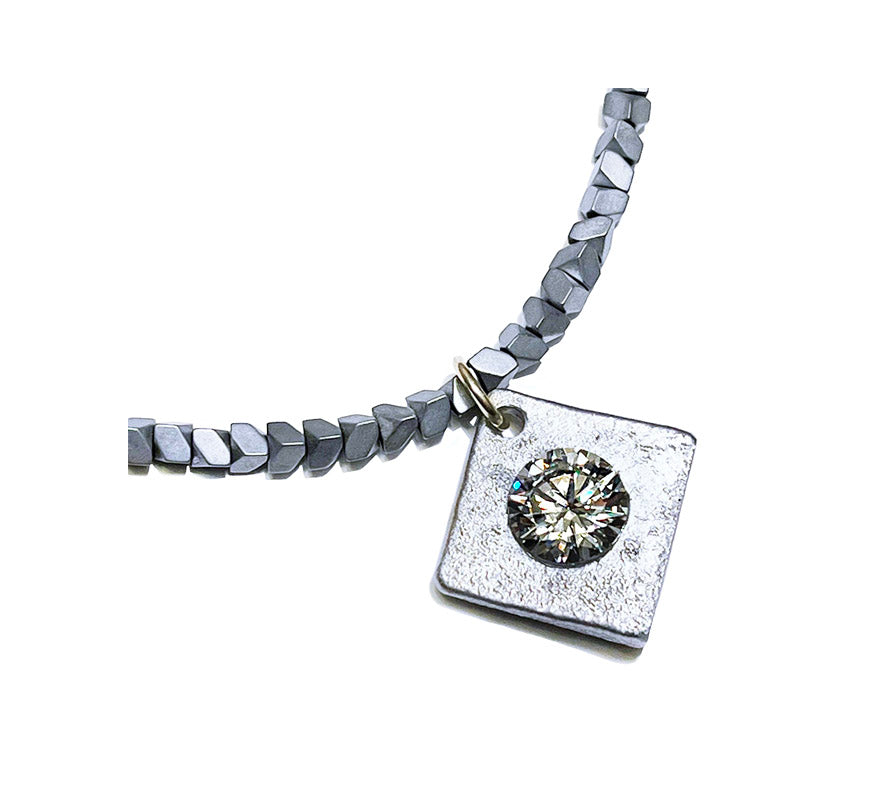 the aluminum solitaire hematite necklace